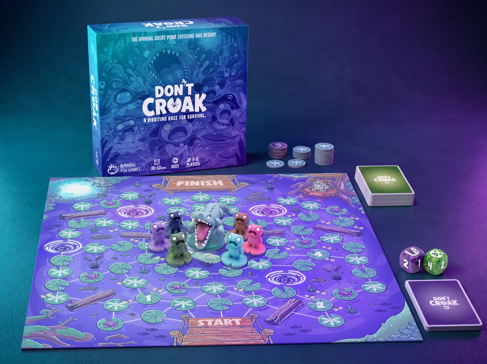 Don’t Croak game box, colourful pond board, six frog miniatures, crocodile, cards, tokens and movement dice