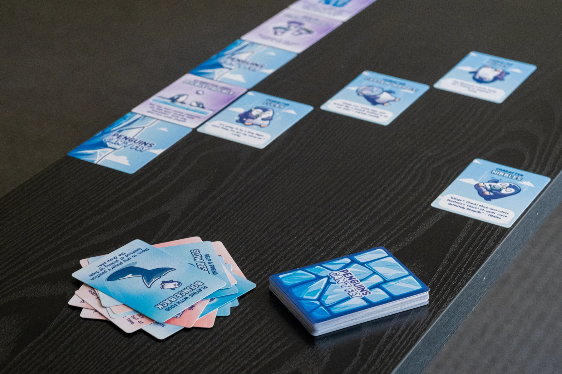Penguins game cards laid out on a table